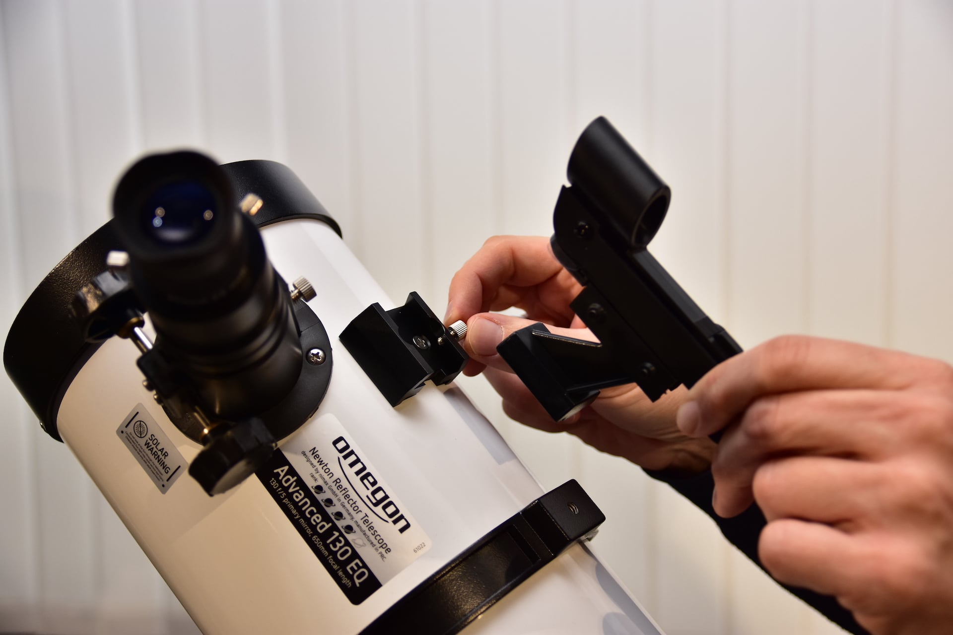 How do you align your viewfinder with the telescope?